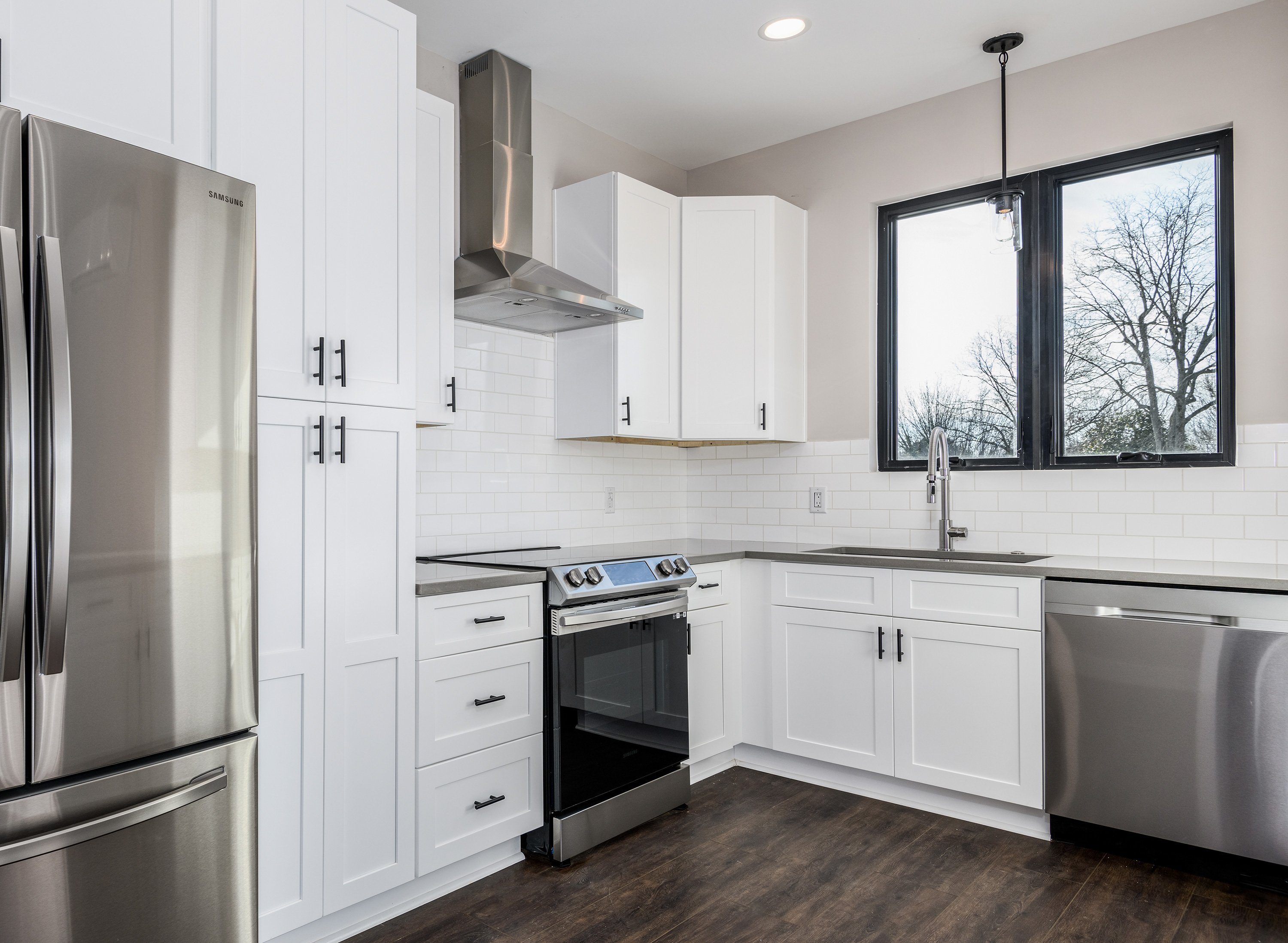 kitchen with white subway tile panel backsplash