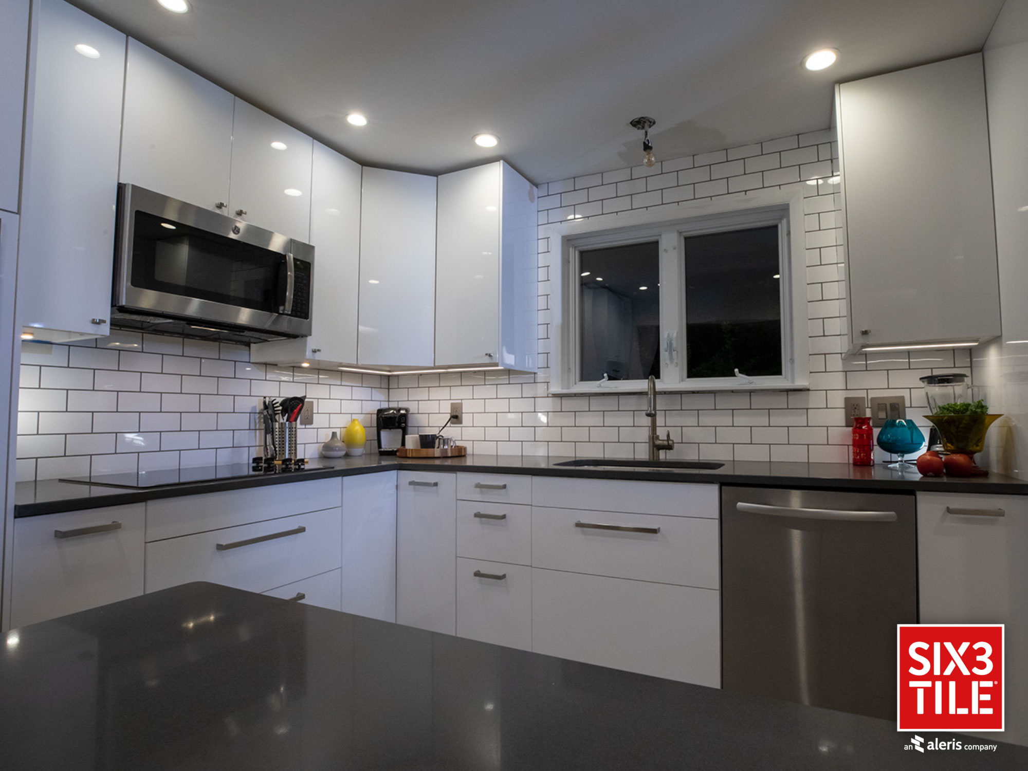 Kitchen with white subway tile panel backsplash